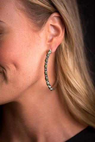 Petite point style hoop earring in burnished silver with green stones
